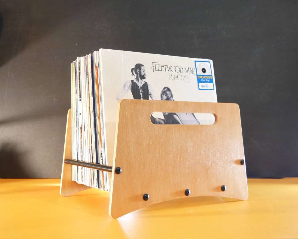 an open wood crate holding vinyl records